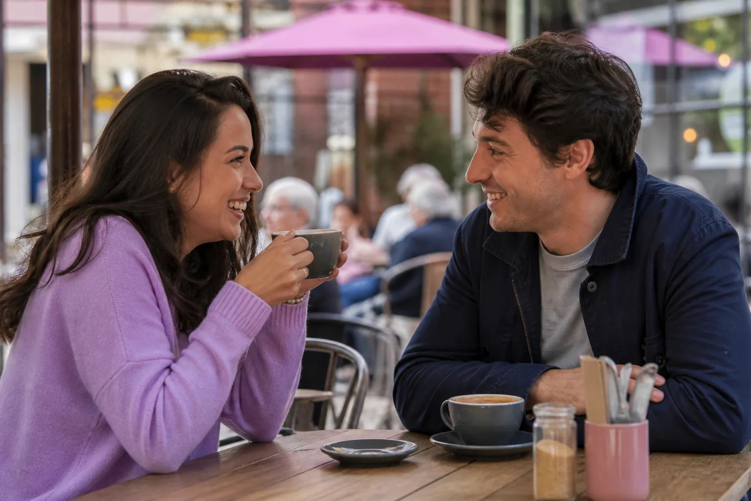 Two people chatting over coffee in Reading town centre